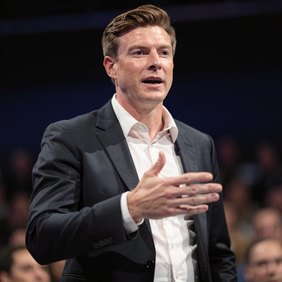 André speaking at a conference